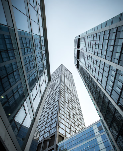 vertical-low-angle-shot-high-rise-skyscrapers-glass-facade-frankfurt-germany_181624-7114 (1)